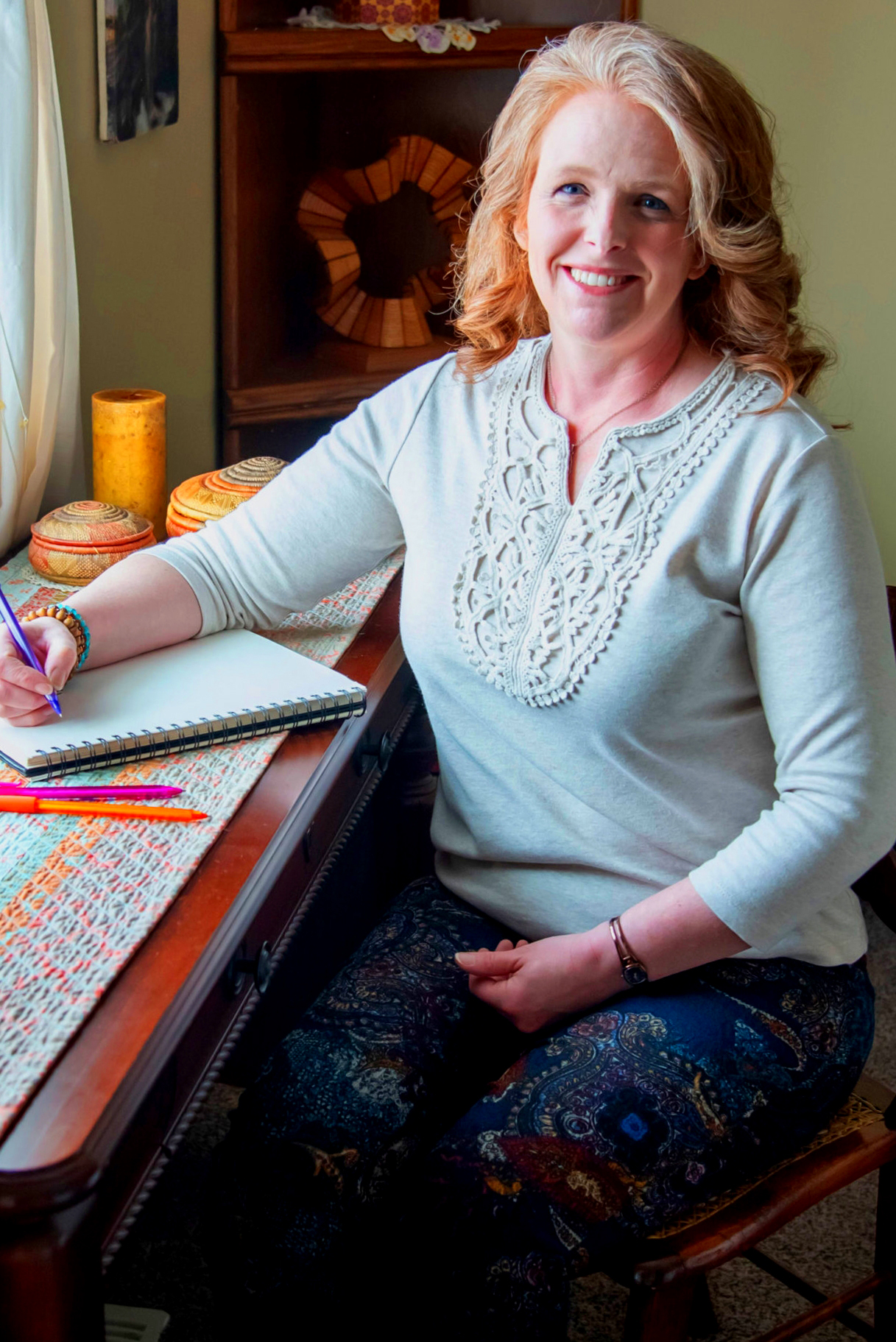 woman-meditating-with-tray-with-candles